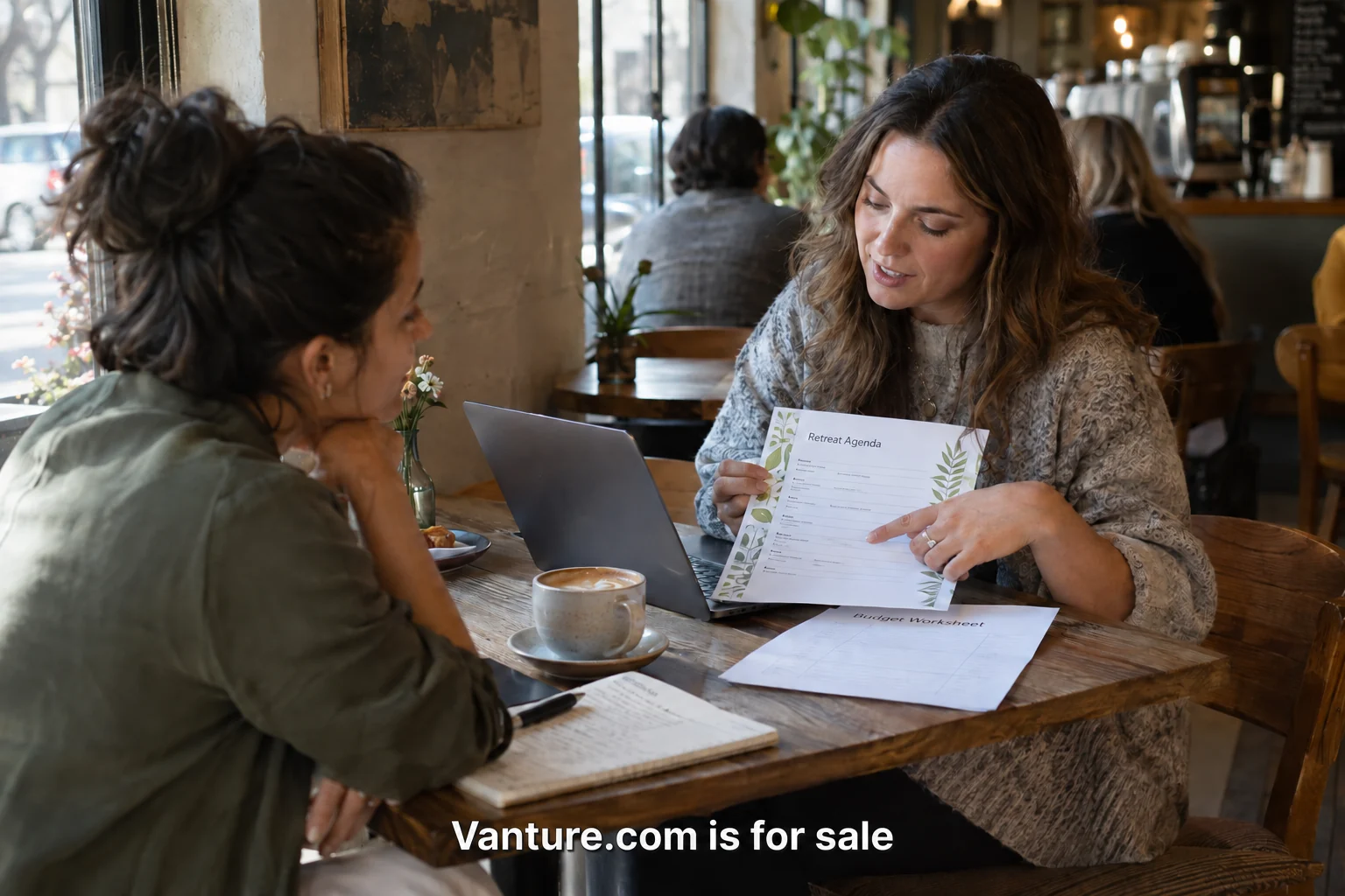 People discussing a sample retreat agenda around a table